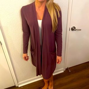 Plum colored long cardigan with two pockets. Small